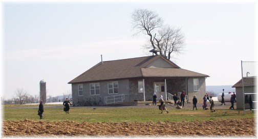 Amish children playing baseball