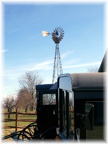 Buggies and windmill on Amish farm