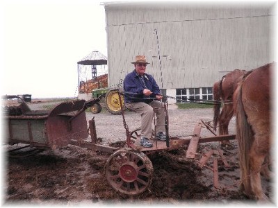Jim Schmidt on manure spreader