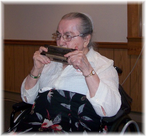 Naomi Wolgemuth playing harmonica