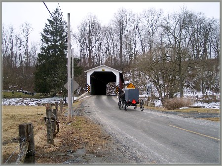 Covered bridge and Amish buggy