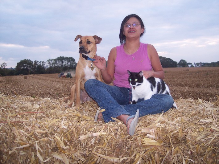 Ester on bale with our pets