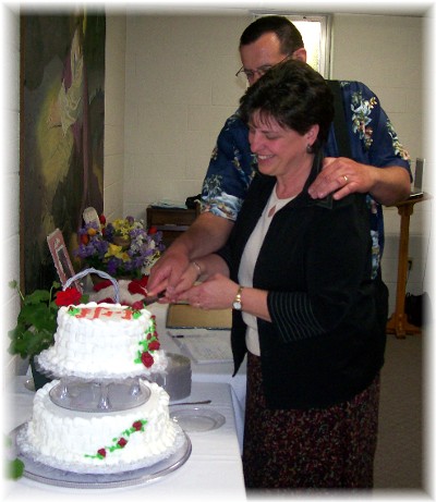Cutting the cake together at our 33rd anniversary party