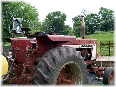 Farmall tractor with child safety seat