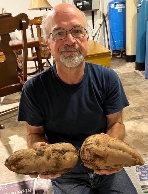 Joe with sweet potatoes (Photo by Mary Lou)