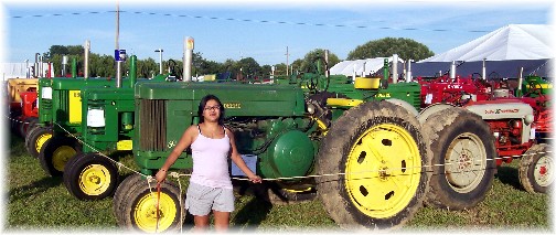 Ester with tractor display at 2011 E-town fair