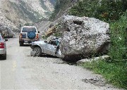 Car crushed by boulder