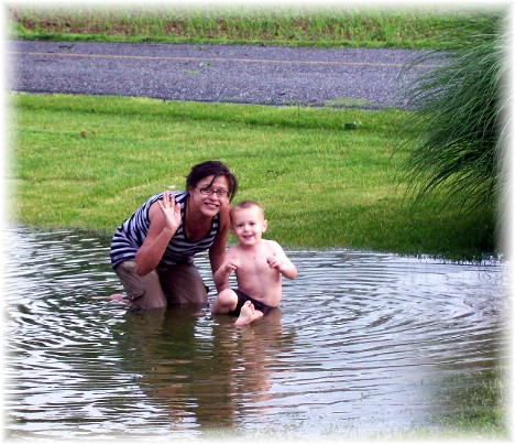 Ester and David playing in pond following Memorial Day storm 5/31/10