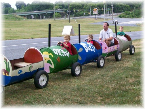 Ken and boys riding barrell train