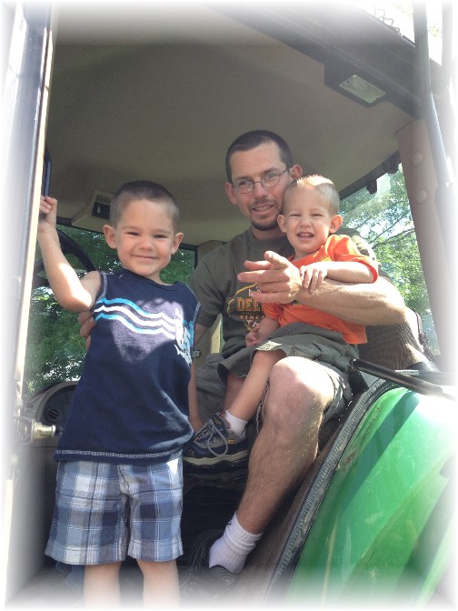 Mike Gardner and sons in tractor cab 6/14/14
