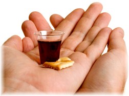 Communion elements in hand