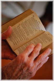 Elderly hands reading Bible