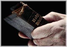 Old man holding Bible