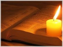 Open Bible with candle