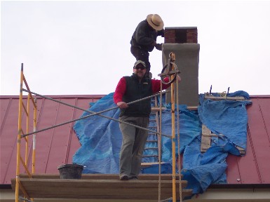 Laborer on scaffold