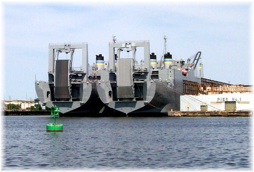 Large naval roll-on/roll-off cargo ships in Baltimore's inner harbor