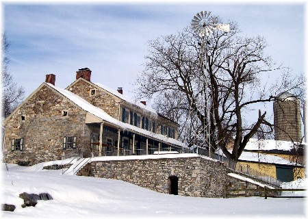 Stone farmhouse in snow