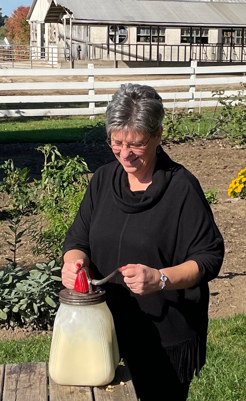 Churning butter at Amish farmhouse experience