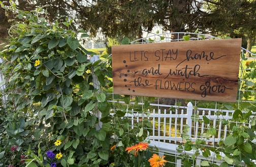 Watch the flowers sign