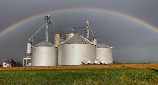 Rainbow over grain bins